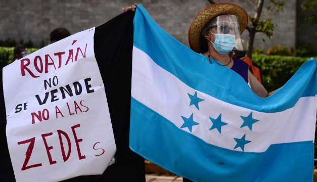 Cover image for Charter Cities and Legal Imperialism: Honduras on the Frontline